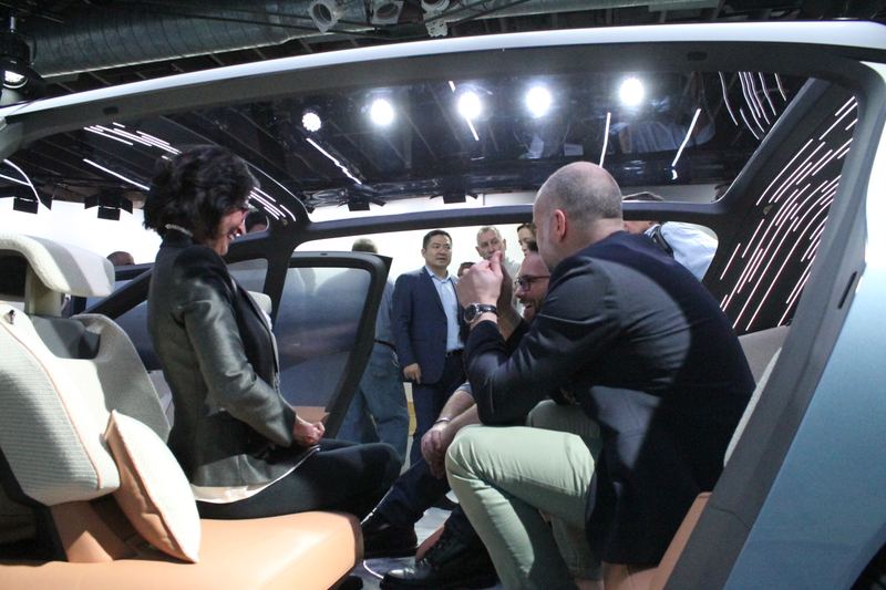 NIO staff chats inside the car. Photos and reporting from Stef Schrader for Jalopnik